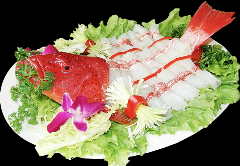Sliced raw grouper fish arranged on a platter with the red fish head, lettuce and orchid garnish